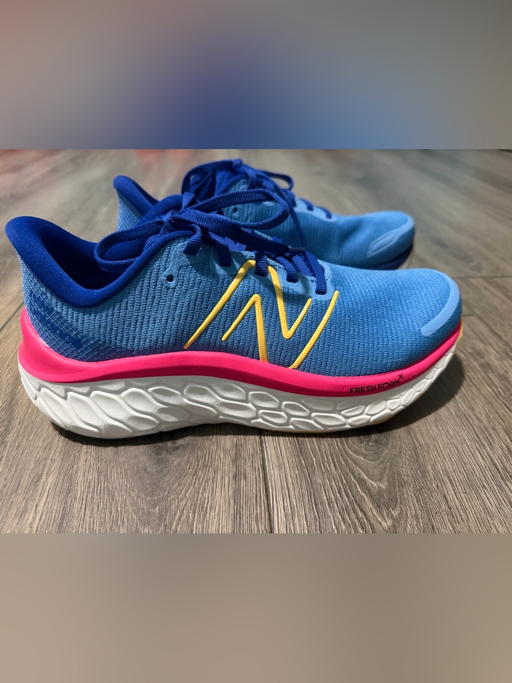 New Balance women’s kaiha road Blue Sneakers with Pink Midsole and Yellow Logo